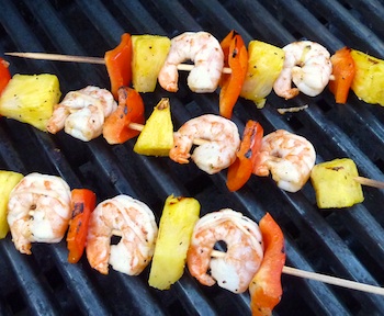 Picture shrimp kabobs cooking on a grill / www.super-seafood-recipes.com